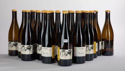 six bottles of wine are lined up in a row on a table