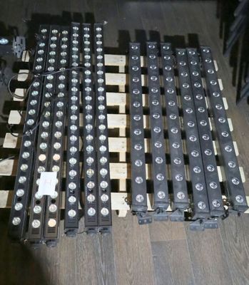 a pile of batteries on a wooden pallet on the floor