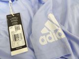 a blue shirt with a white adidas logo on it
