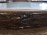 a close up of a wooden bowl on a table
