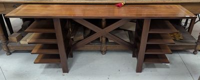 a wooden table with a red apple on it