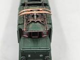 a toy train on the tracks on a white surface