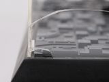 a close up of a computer keyboard with a broken glass cover