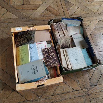 a box full of books sitting on the floor