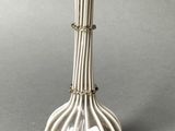 an image of a silver vase sitting on top of a table