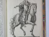 a book with a drawing of a man riding a horse