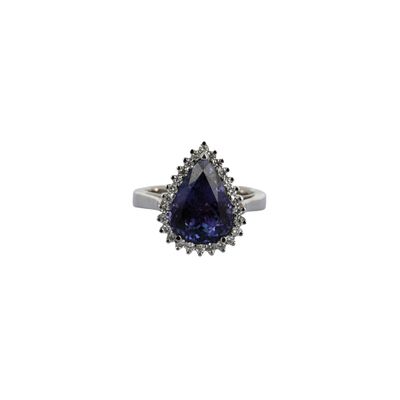 a close up of a ring with a blue stone on it