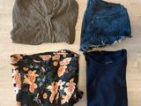 three pieces of clothing laid out on a wooden floor