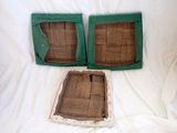 two pieces of wood that are sitting on a bed