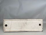 an image of a metal plate with holes in it