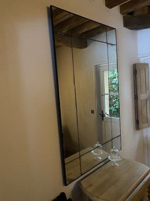 a bathroom with a sink and a mirror in it