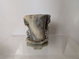a vase that is sitting on top of a glass table