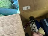 a person that is holding a gun in a box