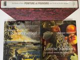 three books that are sitting on top of a table