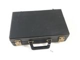 a black suitcase that is sitting on a white surface