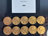 a lot of gold coins that are on a table
