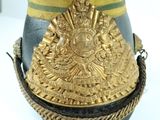 an image of a military hat with a gold decoration