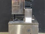 an image of a machine with a basket on top of it