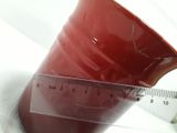 a plastic cup with a measuring tape on it