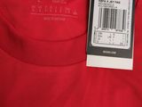 the back of a red adidas t - shirt with a tag on it