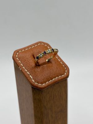 a close up of a ring sitting on top of a wooden box