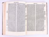 an open book on a white surface with a white background