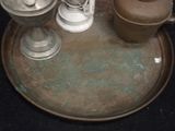 a metal tray with a tea pot and two cups on it