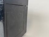 an image of a black microwave oven with a door open