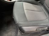 a close up of a car ' s front seats with a steering wheel