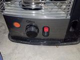 an image of a stove with a pot on top of it