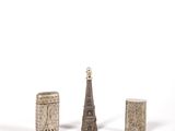 a small group of objects sitting on a white surface