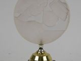 trophy on a marble base with a gold plated base and a white background