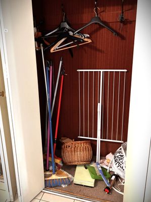 a closet with a lot of clothes hanging on a rack
