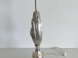 a lamp that is sitting on a table with a cord