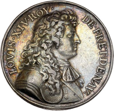 a silver coin with a portrait of a man with long hair