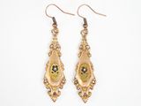 an image of a pair of gold colored earrings with flowers on them