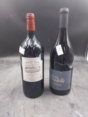 two bottles of wine sitting next to each other on a table