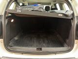 the back of a car with a bed in the back of it