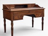 an old wooden desk with a drawer on top of it