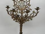 an ornate brass candelab with five candelabs in the shape of a tree