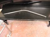 a black table with a metal handle on top of it