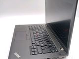 a laptop that is open on a white surface