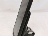a cell phone that is sitting on top of a stand