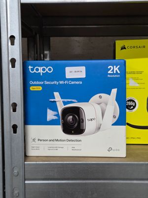two cameras sitting on a shelf in a store