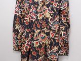 a women ' s shirt with a floral pattern on it