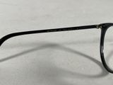 the glasses are made of plastic and have a black frame