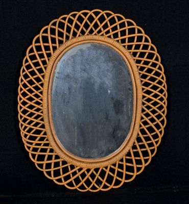 a mirror that is sitting on a black surface