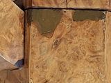 a wooden box that has a handle on top of it