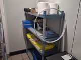 a small room with a shelf and a television