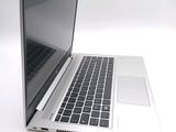 a close up of a laptop computer on a white surface
